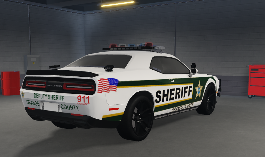 Orange County Sheriff patrol car with green stripes and American flag